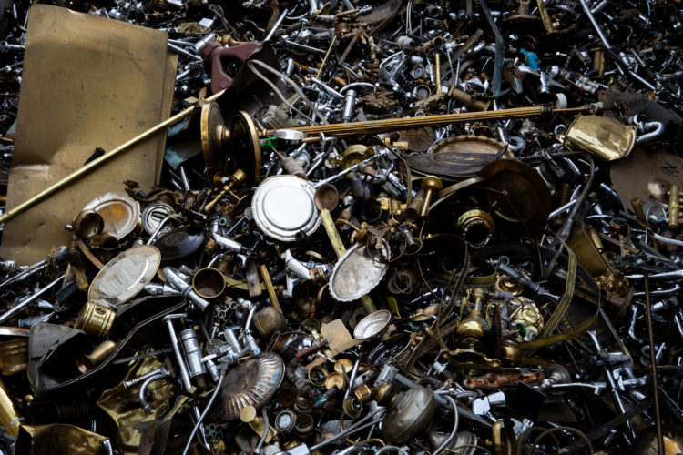 A scrap of mixed brass material from a recycling company in the purpose of a wallpaper.